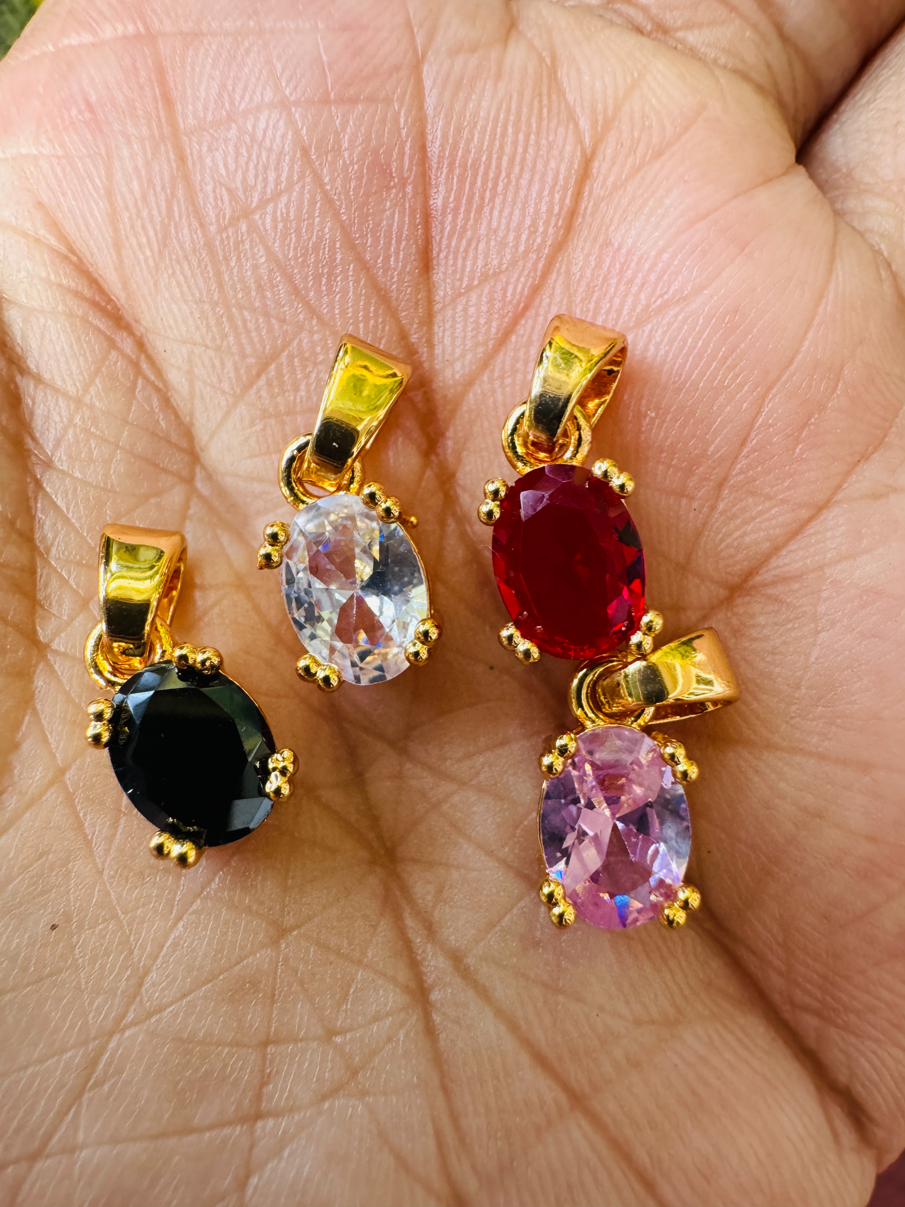 Gold Plated Oval Type Pendant with Red, Black, Pink & White Color Stones for Women
